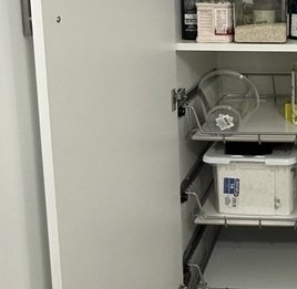 Pull-out wire drawers inside the pantry cabinet